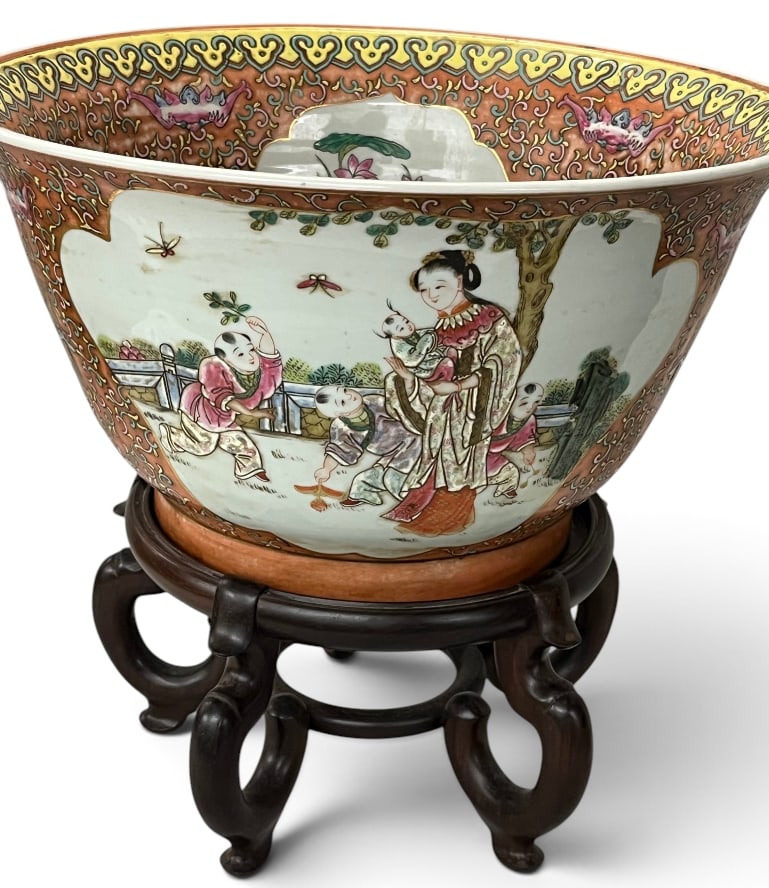 Chinese Famille Rose porcelain punch bowl: Chinese Famille Rose porcelain punch bowl with wooden base. Bowl Approx. 15 x 10 inches.