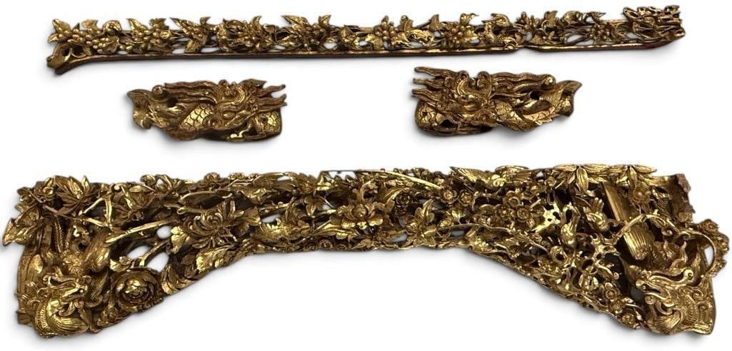 Chinese carved architectural pieces: Heavily carved Chinese gold gilt architectural pieces. 4 pieces. Featuring flowers, dragons, birds and more. Arch piece approx. 34 x 8 x 4 inches.