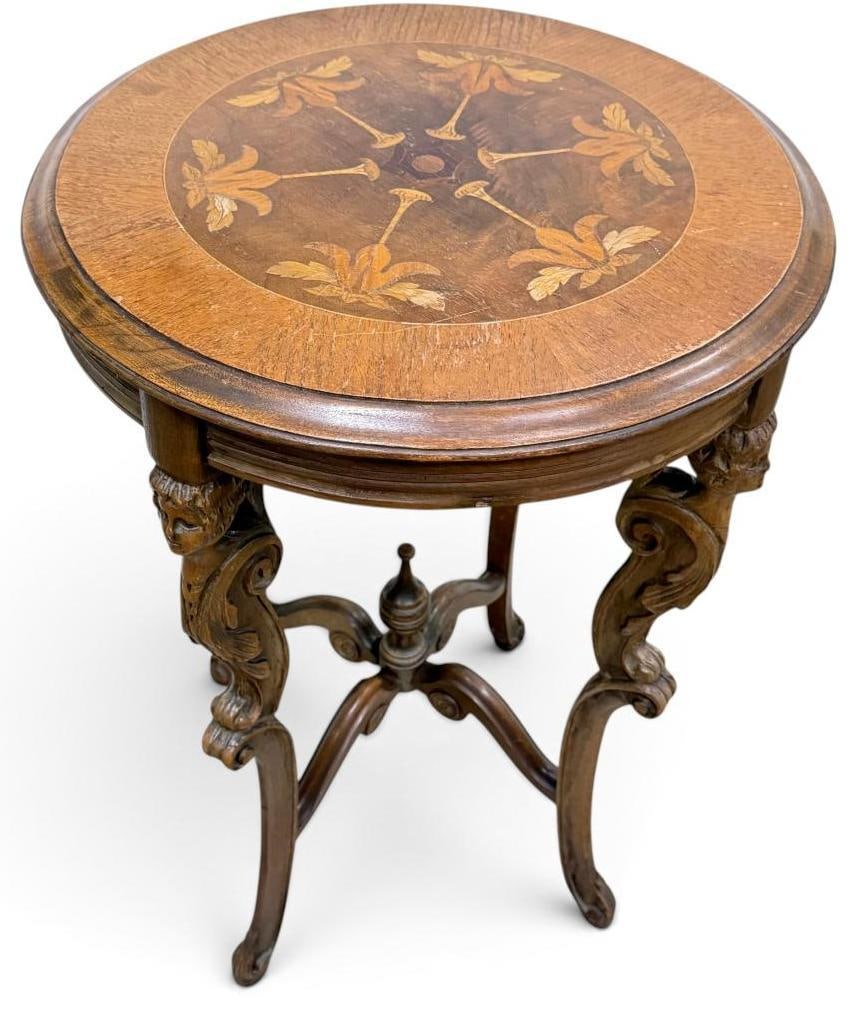 French accent table with floral marquetry: French Walnut accent table with floral marquetry and carved legs. Approx. 30 x 20 x 20 inches.