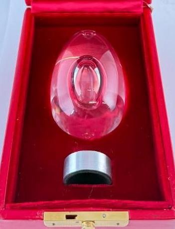 Steuben Art Glass Egg with Ovoid Bubble: Steuben Art Glass Egg with Ovoid Bubble. Includes case and stand. Egg approx. 3.75 x 2.25 x 2.25 inches.