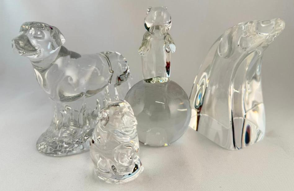 4 Steuben Art Glass Paperweights: 4 Steuben Art Glass Paperweights. Including dogs and bear on ball. Dog is signed Taf Schaefer. Tallest approx. 5 inches.