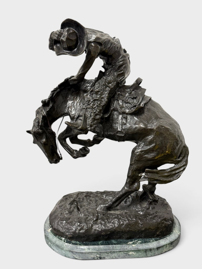 Frederic Remington "The Rattlesnake" sculpture: Frederic Remington bronze "The Rattlesnake" sculpture. Approx. 23 x 16 x 10 inches.