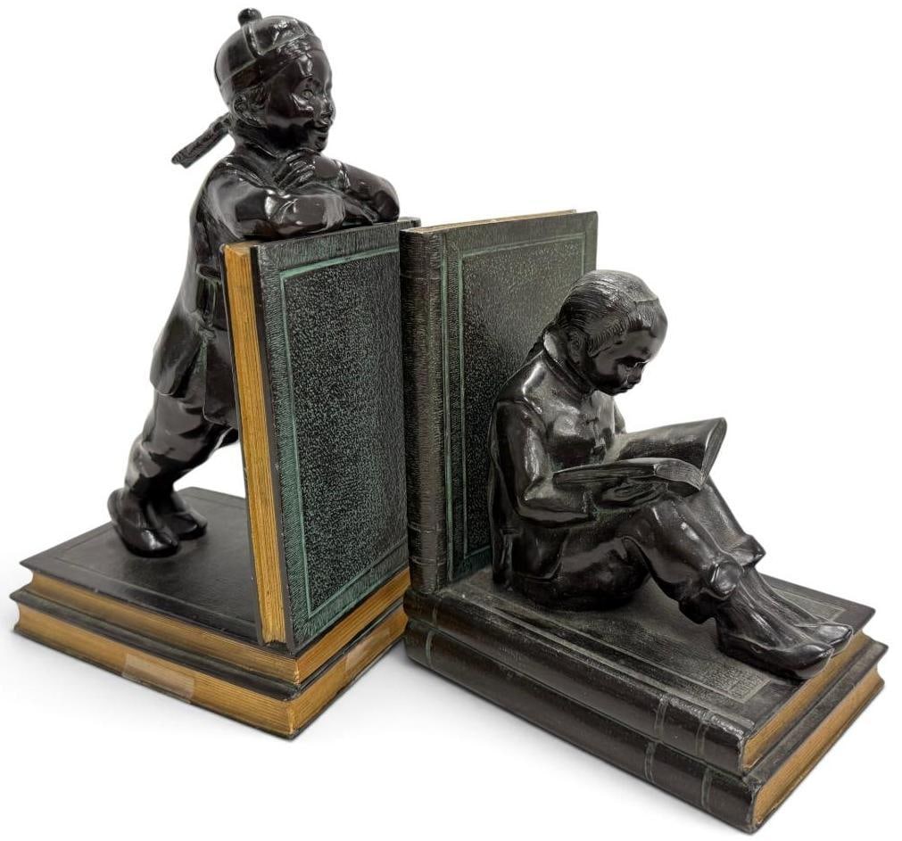 Pair of Art Deco figural bookends: Ronson Art Metal Works Pair of Art Deco figural bookends, chinese scholar / student design. C.1920's. Approx. 9 x 5 x 4 inches.