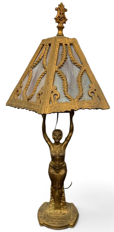 Slag Glass lamp with metal overlay: Slag Glass lamp with metal overlay on Egyptian Revival figural base. Approx. 27 x 14 x 14 inches.