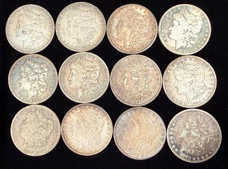 12 Morgan Silver Dollars: 12 Morgan Silver Dollars.