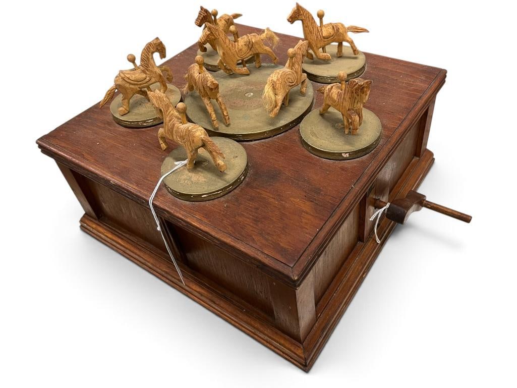Vintage mechanical wooden carousel: Vintage mechanical wooden carousel. Approx. 11 x 14 x 14 inches.