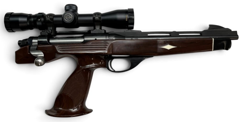 Remington Model XP-100 .221 Fireball pistol: Remington Model XP-100 .221 Fireball pistol. Includes Simmons scope. Overall length approx. 18 inches. Serial # 5282.
