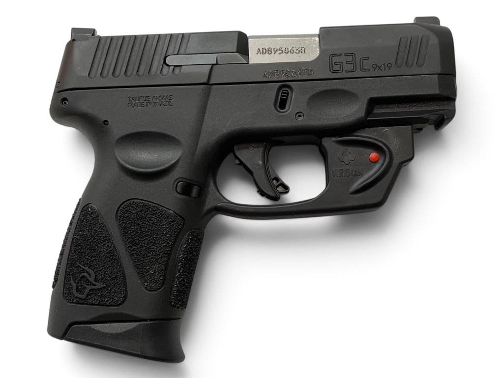 Taurus G3C 9mm pistol: Taurus G3C 9mm semi auto pistol, with Viridian laser. Includes 3 magazines. Serial # ADB958630.