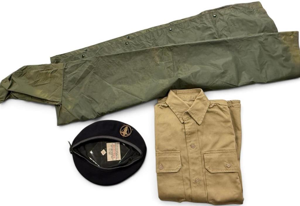 South Vietnam Shirt, Poncho and Beret: South Vietnam Khaki Uniform Shirt dated 1963, CISO DAJ Poncho with nomenclature and Cao Dao Beret. 3 pieces.