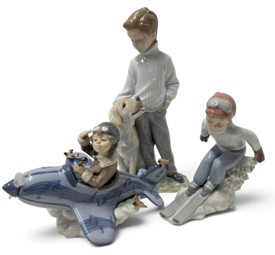 3 Lladro Figures: 3 Lladro Figures. Including I'll Get There First, Over The Clouds and My Local Friend. Largest box approx. 12 x 7 x 6 inches.