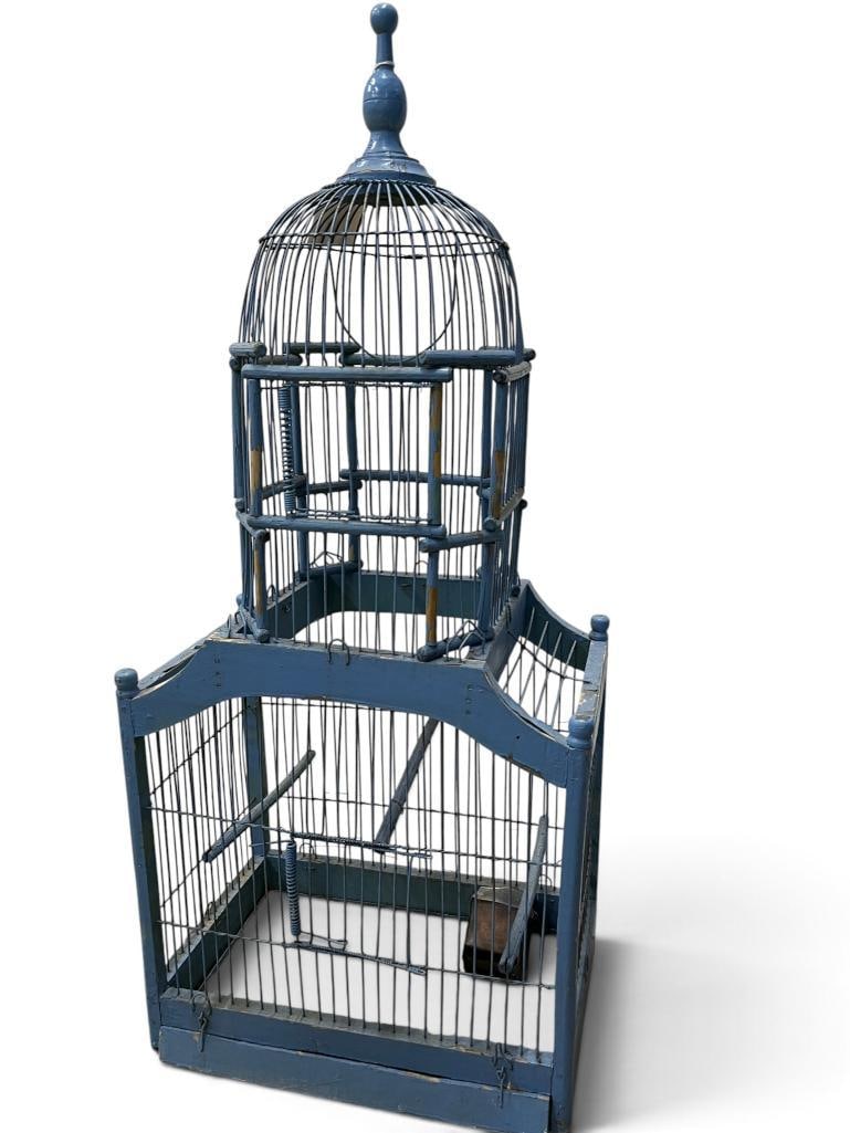 Antique metal wire and wood bird cage: Antique metal wire and wood bird cage. Approx. 33 x 15 x 10 inches.
