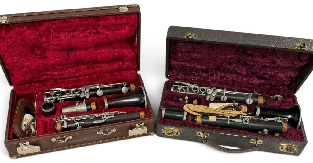 2 Clarinets in cases: 2 Clarinets in cases. 1 is marked Normandy.