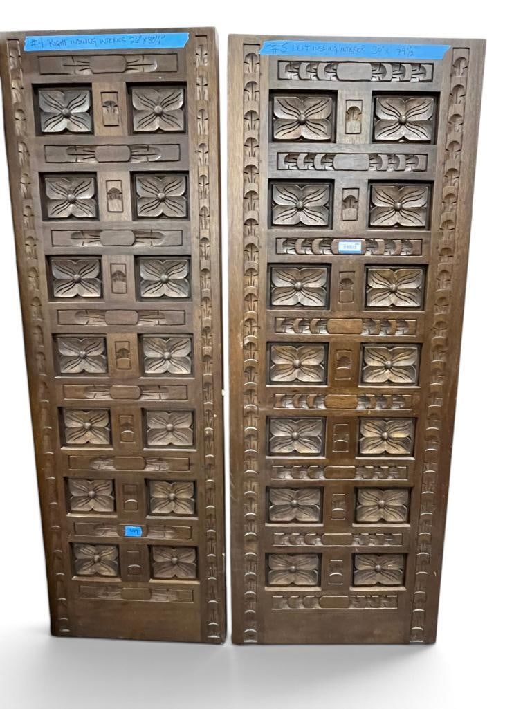 2 Walnut Relief Carved Doors: 2 Oak Walnut Carved Doors. Approx. 79.5 x 30 inches and 80.25 x 26 inches.