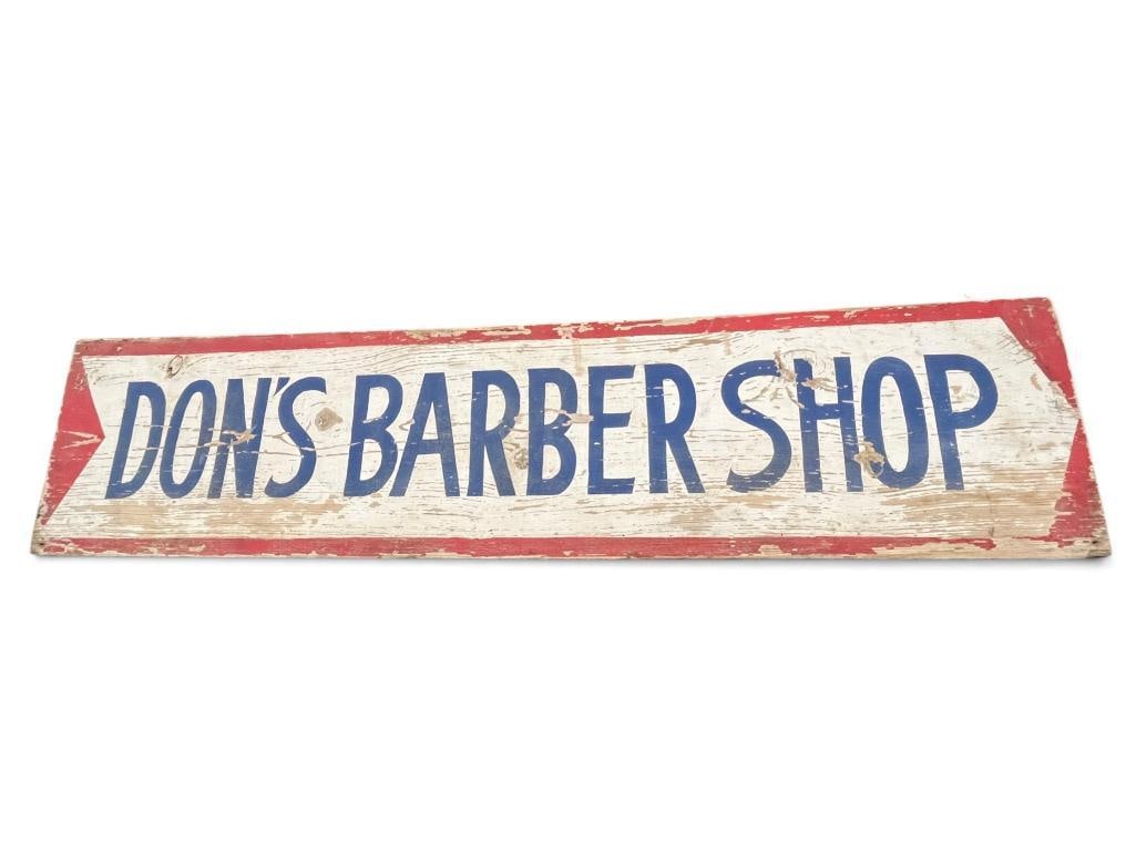 Don's Barber Shop wood advertising sign: Don's Barber Shop wood advertising sign. Approx. 48.5 x 11.5 inches.