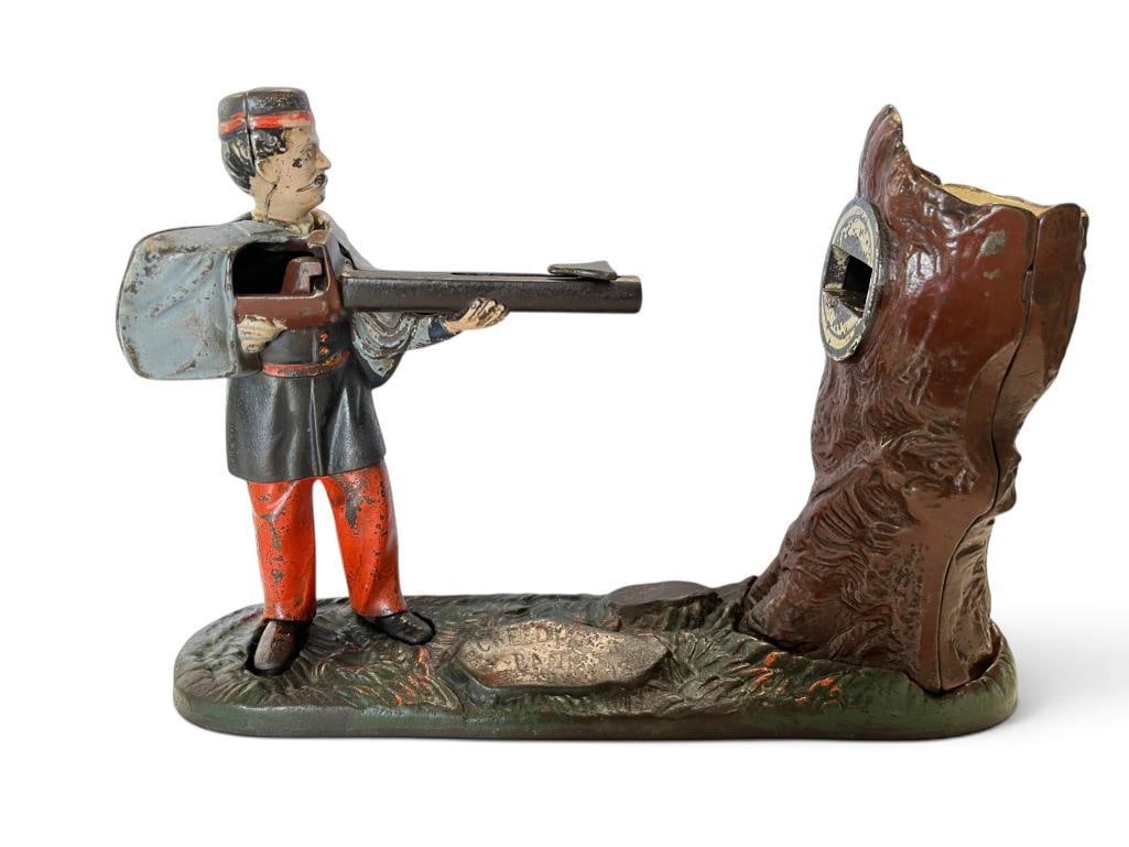Creedmoor Cast Iron Mechanical Bank: Creedmoor Cast Iron Mechanical Bank. Approx. 10 x 7 x 3 inches.
