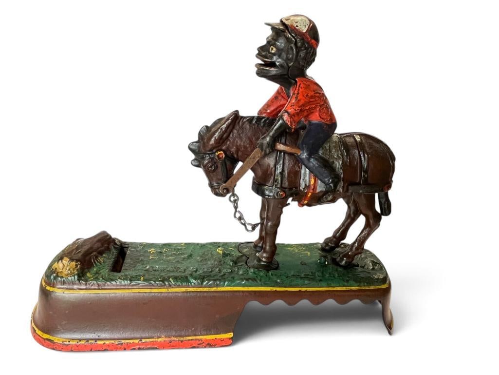 J & E Stevens Mule Mechanical Bank: J & E Stevens Always did 'Spise a Mule Mechanical Bank. Approx. 10 x 7 x 3 inches.