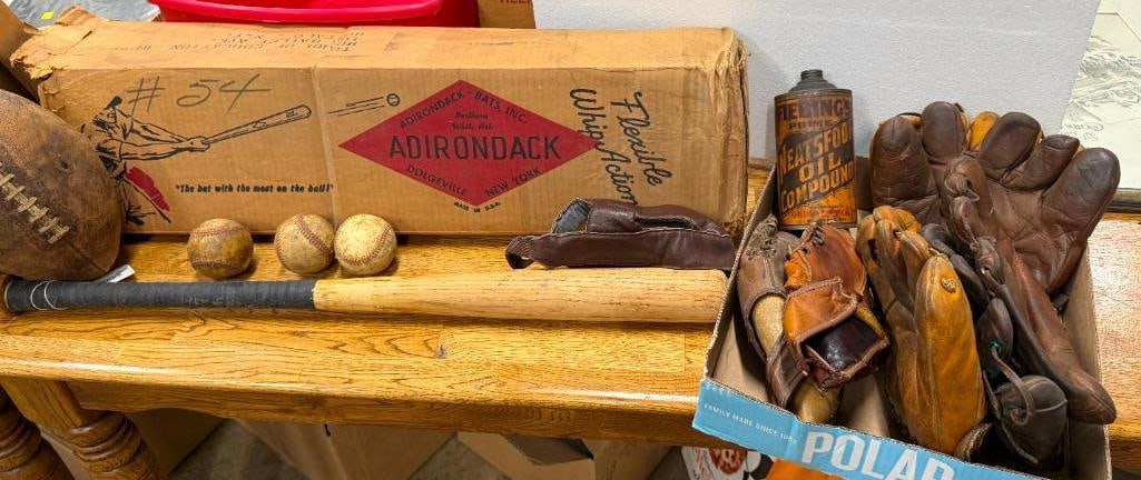 Adirondack Baseball Bat, Leather Football Helmet etc: Adirondack Baseball Bat, balls, Leather Football Helmet, 7 Baseball Gloves and Fiebing's Neatsfoot Oil Can. and football. 13 pieces.