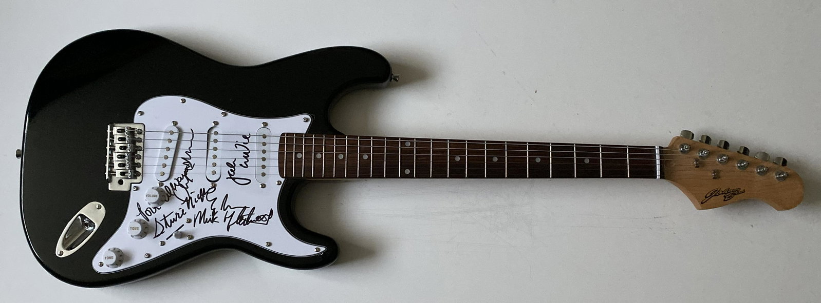 Fleetwood Mac Fully Signed Electric Guitar Certified: This lot is an electric guitar autographed by all members of Fleetwood Mac. Item comes with Certificate of Authenticity guaranteeing it for a lifetime. Item comes with time and place of signing detail