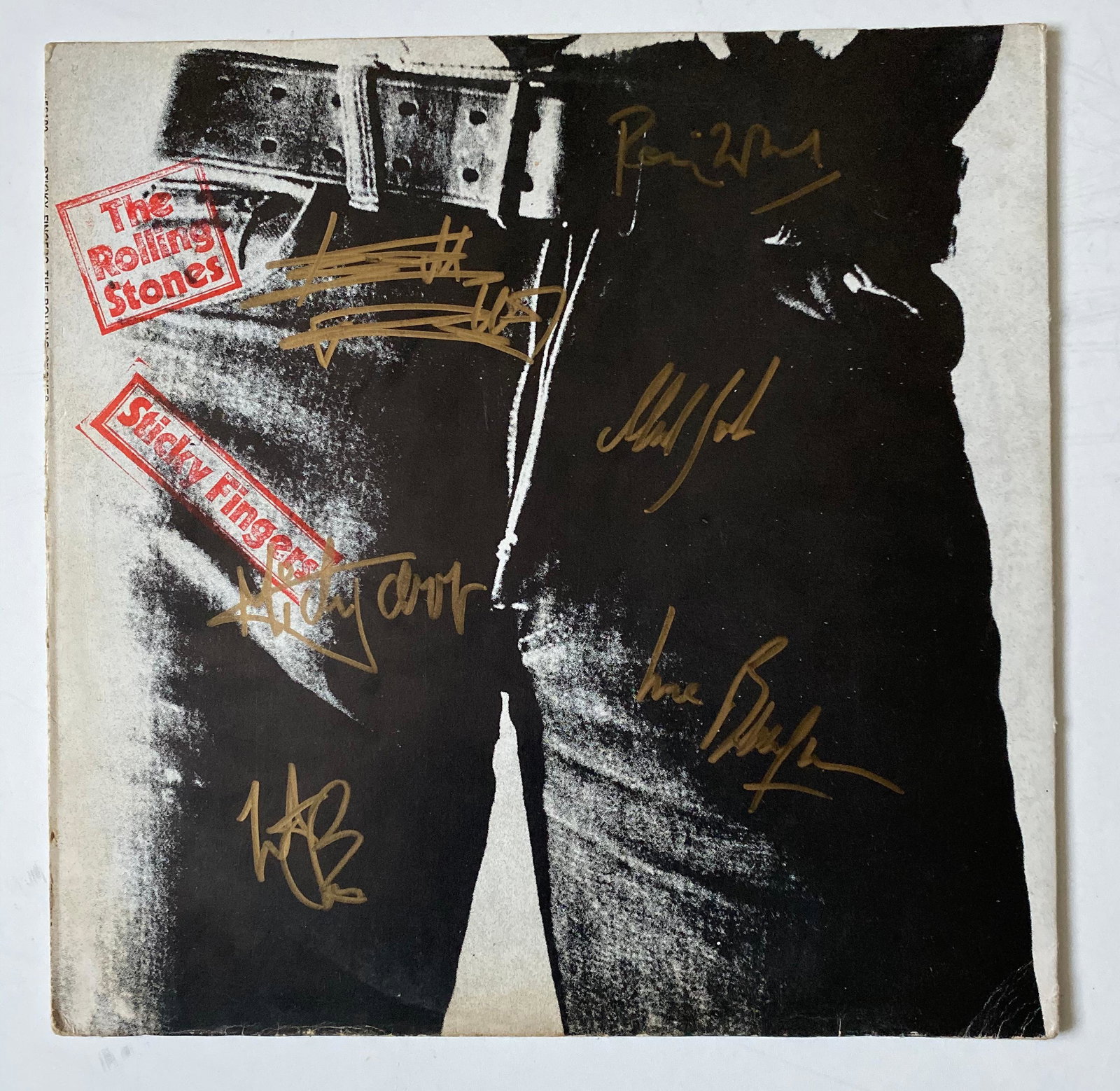 The Rolling Stones Fully Signed Sticky Fingers Vinyl LP: This lot is a vinyl LP (Sticky Fingers) autographed by Mick Jagger, Keith Richards, Ronnie Wood, Charlie Watts, Bill Wyman and Mick Taylor of The Rolling Stones