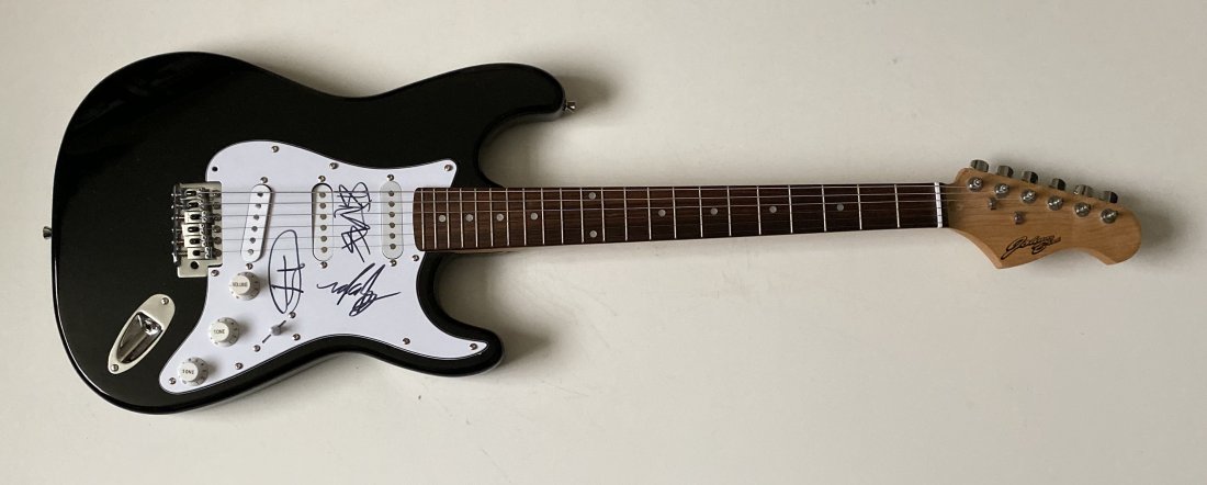 Blink 182 Fully Signed Electric Guitar Certified: This lot is an electric guitar, autographed by Mark Hoppus, Tom Delonge and Travis Barker of Blink 182. Item comes with Certificate of Authenticity, guaranteeing it for a lifetime.