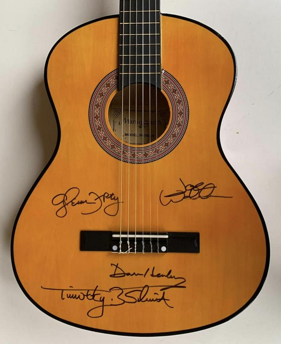 The Eagles Fully Signed Acoustic Guitar Certified: This lot is an acoustic guitar autographed by Don Henley, Glenn Frey, Timothy B Schmidt and Joe Walsh of The Eagles