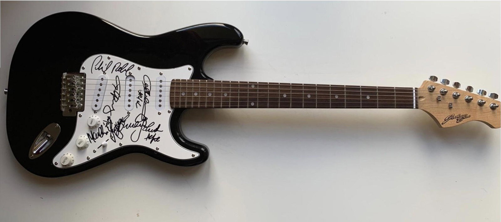 AC/DC Fully Signed Electric Guitar Certified: This lot is an electric guitar autographed by Brian Johnson, Angus Young, Malcolm Young, Cliff Williams and Phil Rudd of AC/DC