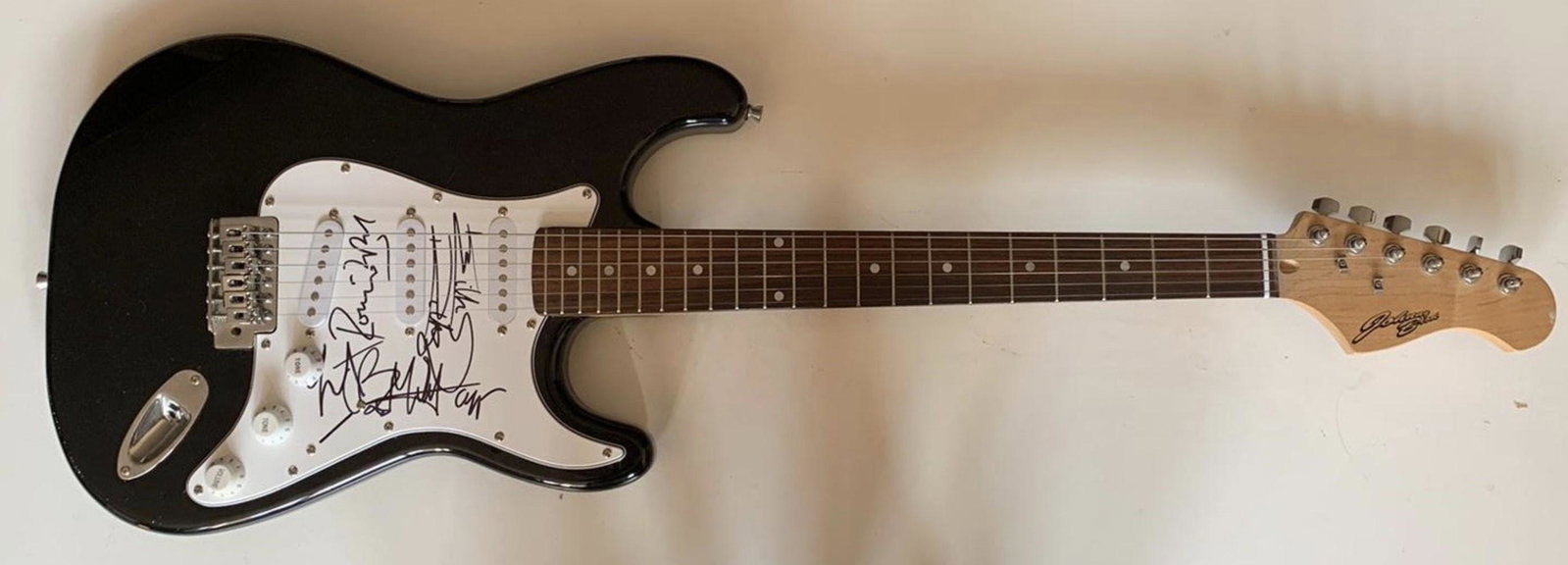 The Rolling Stones Fully Signed Electric Guitar: This lot is an electric guitar autographed by Mick Jagger, Keith Richards, Charlie Watts and Ronnie Wood of The Rolling Stones