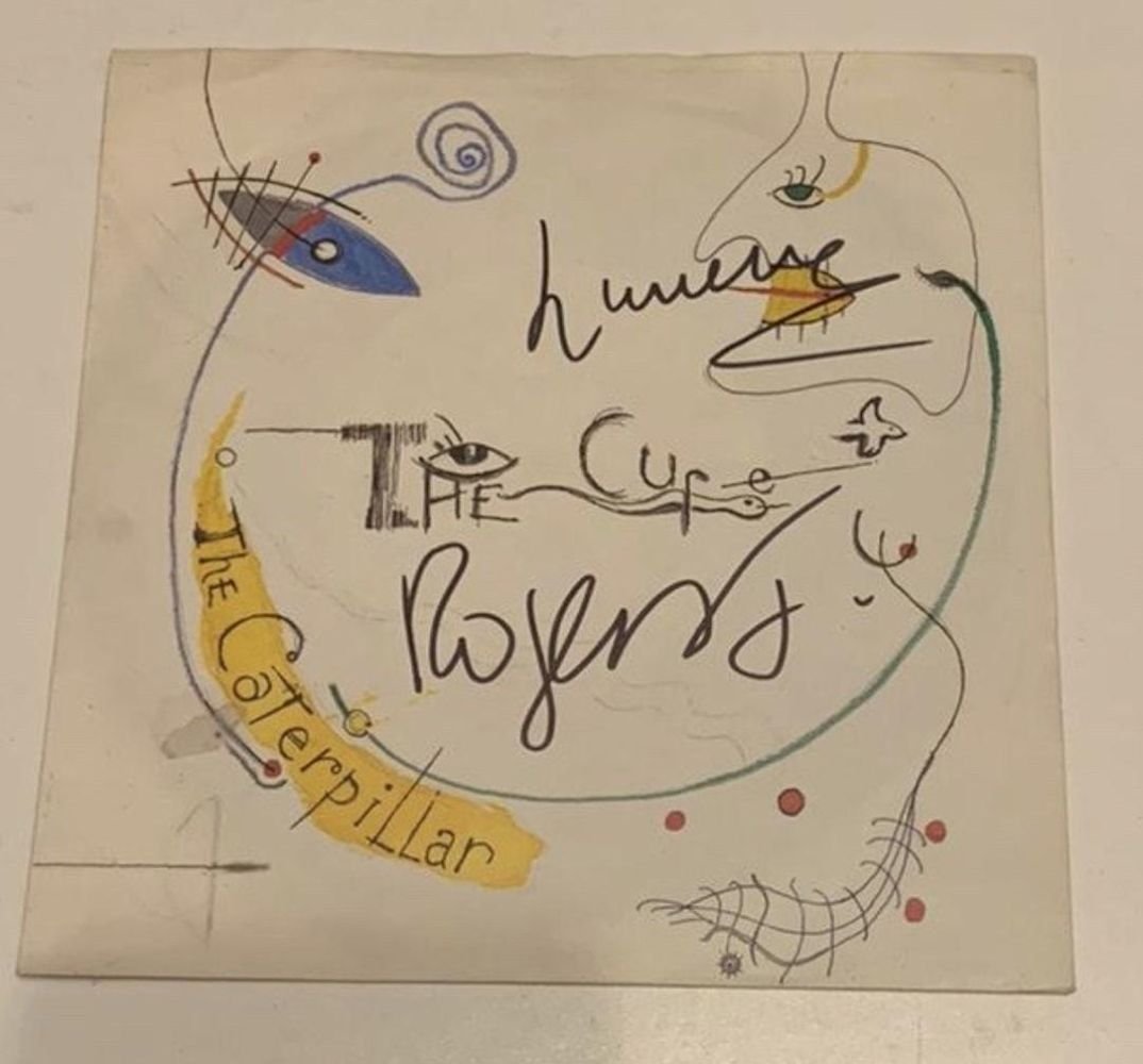 The Cure Signed Vinyl 45 35: This lot is a vinyl single (The Caterpillar) autographed by Robert Smith of The Cure. Item comes with Certificate of Authenticity guaranteeing it for a lifetime.