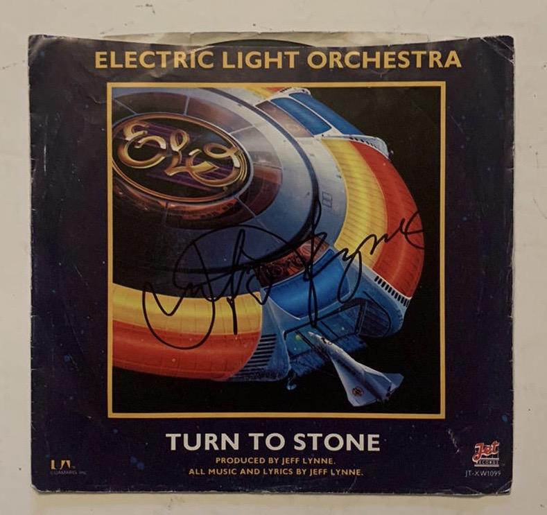 ELO Jeff Lynne Signed Turn To Stone Vinyl Certified: This lot is a vinyl 45 single (Turn to Stone) autographed by Jeff Lynne of ELO. Item comes with Certificate of Authenticity guaranteeing it for a lifetime