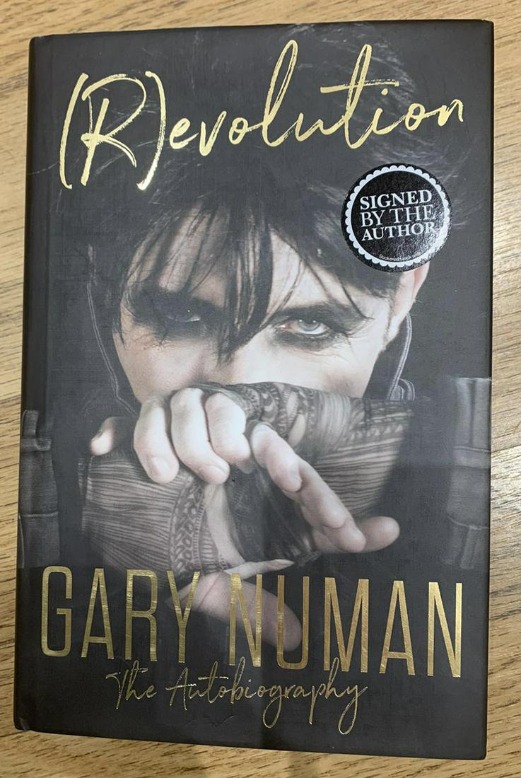 Gary Numan Signed Revolution Hardback Book Certified: This lot is a hardback book autographed by Gary Numan. Item comes with Certificate of Authenticity guaranteeing it for a lifetime