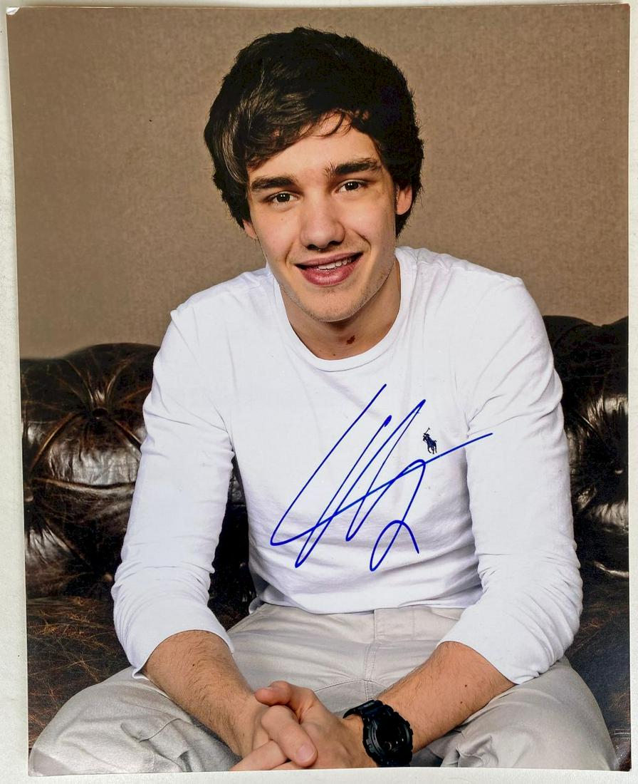 Louis Tomlinson Signed Photograph 1D One Direction: This lot is photograph autographed by Louis Tomlinson of One Direction. Item comes with Certificate of Authenticity guaranteeing it for a lifetime
