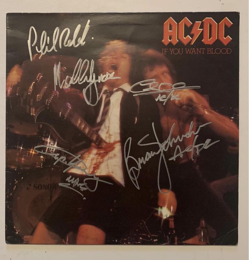 AC/DC Fully Signed Vinyl LP Certified: This lot is a vinyl LP (If you want blood) autographed by Brian Johnson, Angus Young, Malcolm Young, Cliff Williams and Phil Rudd of AC/DC