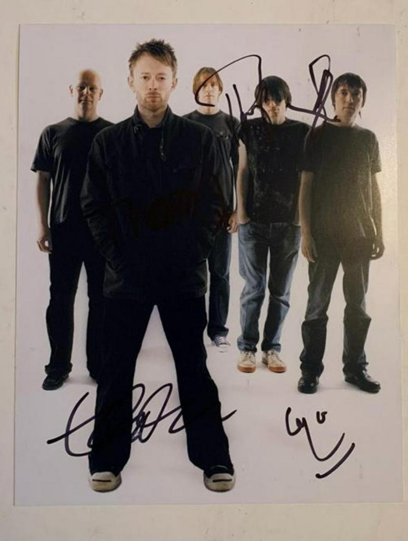 Radiohead Fully Signed Photograph Certified: This lot is a 10’x 8” photograph autographed by Thom Yorke, Colin Greenwood, Jonny Greenwood and Ed O’Brien and Phil Selway of Radiohead