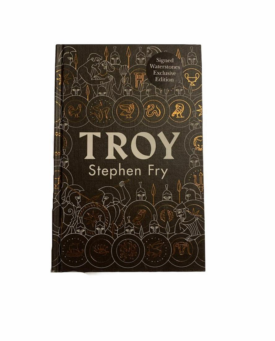 Stephen Fry Signed Troy Hardback Book Certified: This lot is a hardback first edition book, autographed by Stephen Fry. Item comes with Certificate of Authenticity guaranteeing it for a lifetime.