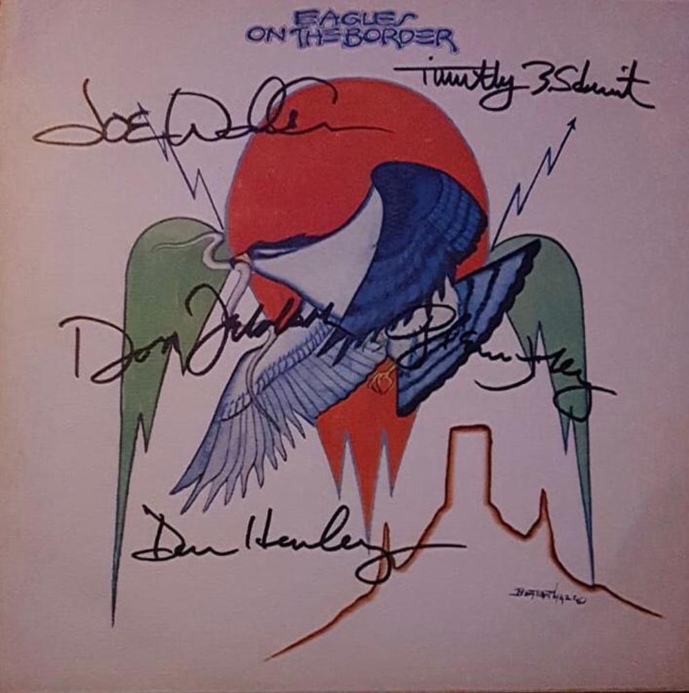 The Eagles Fully Signed On The Border Vinyl Certified: This lot is a vinyl LP autographed by Joe Walsh, Timothy B Schmidt, Don Henley, Glenn Frey and Don Felder of The Eagles