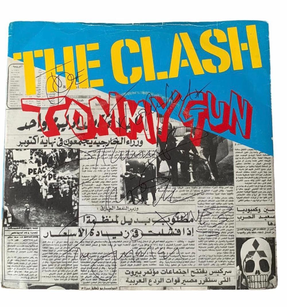 The Clash Signed Tommy Gun 7" Single Certified: This lot is a 7" single (Tommy Gun), autographed by Joe Strummer, Mick Jones and Paul Simonon of The Clash.
