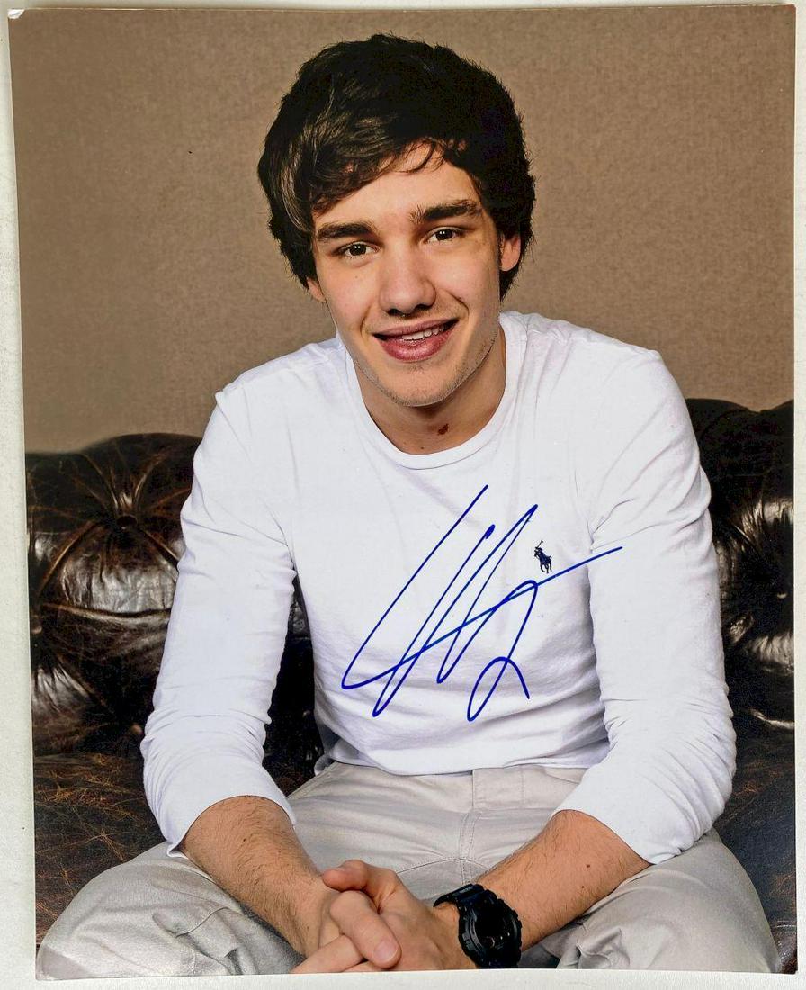 Louis Tomlinson Signed Photograph 1D One Direction: This lot is photograph autographed by Louis Tomlinson of One Direction. Item comes with Certificate of Authenticity guaranteeing it for a lifetime