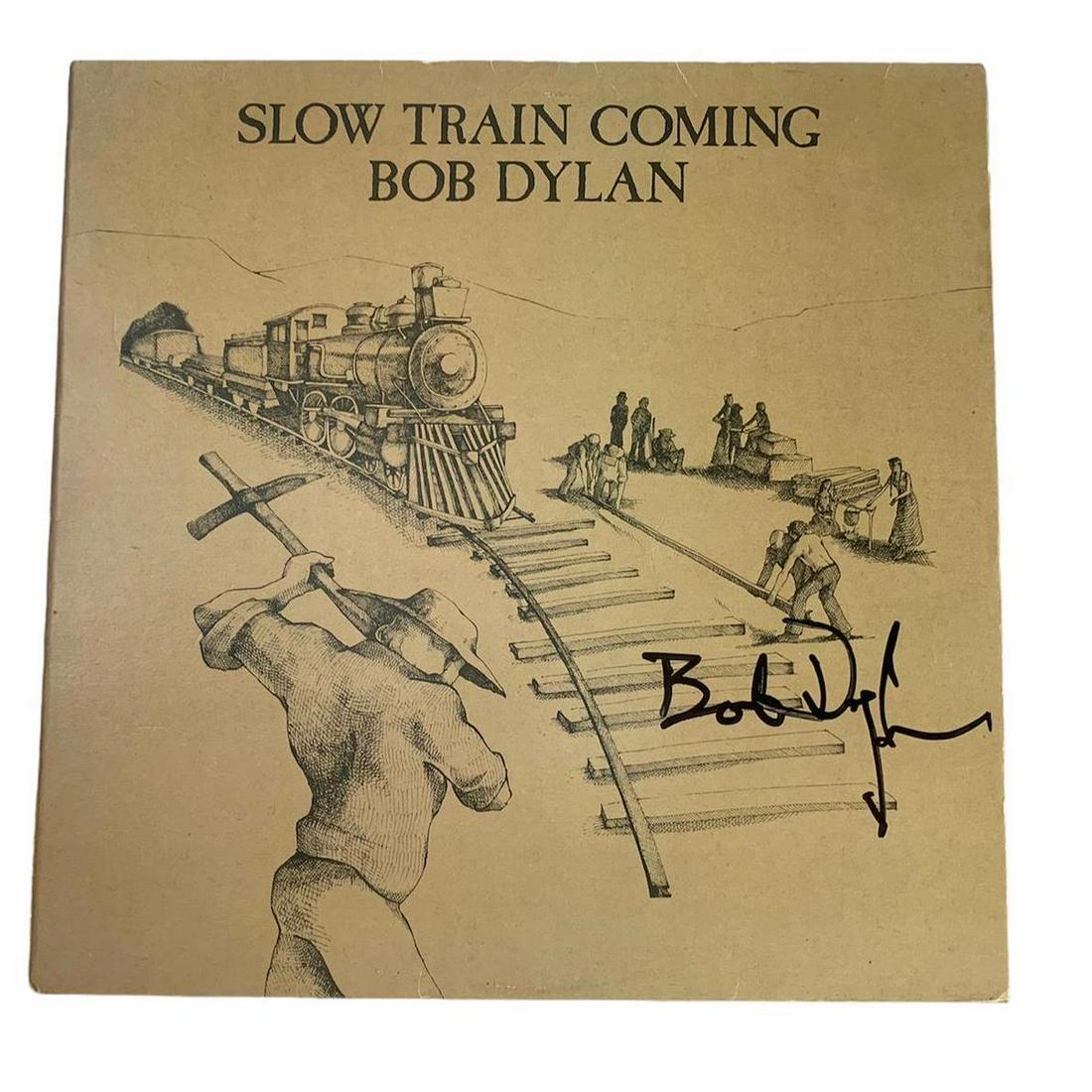 Bob Dylan Signed Slow Train Coming Vinyl LP Certified: This lot is a vinyl LP (Slow Train Coming) autographed by Bob Dylan. Item comes with Certificate of Authenticity, guaranteeing it for a lifetime.