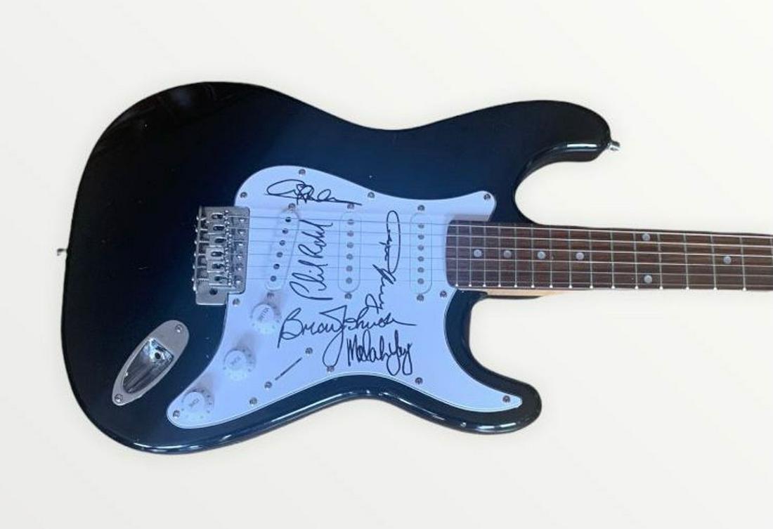 AC/DC Fully Signed Electric Guitar Certified: This lot is an electric guitar, autographed by Angus Young, Malcolm Young, Brian Johnson, Cliff Williams and Phil Rudd of AC/DC. Item comes with Certificate of Authenticity guaranteeing it for a lifet