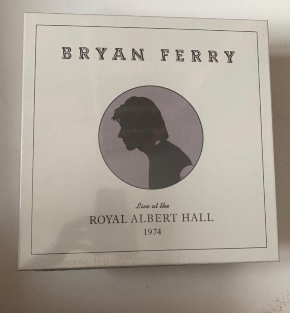 Bryan Ferry Signed Live at the Royal Albert Hall 1974: This lot is an official signed sealed box set of Bryan Ferry Live at the Royal Albert Hall 1974. Item comes with Certificate of Authenticity, guaranteeing it for a lifetime.