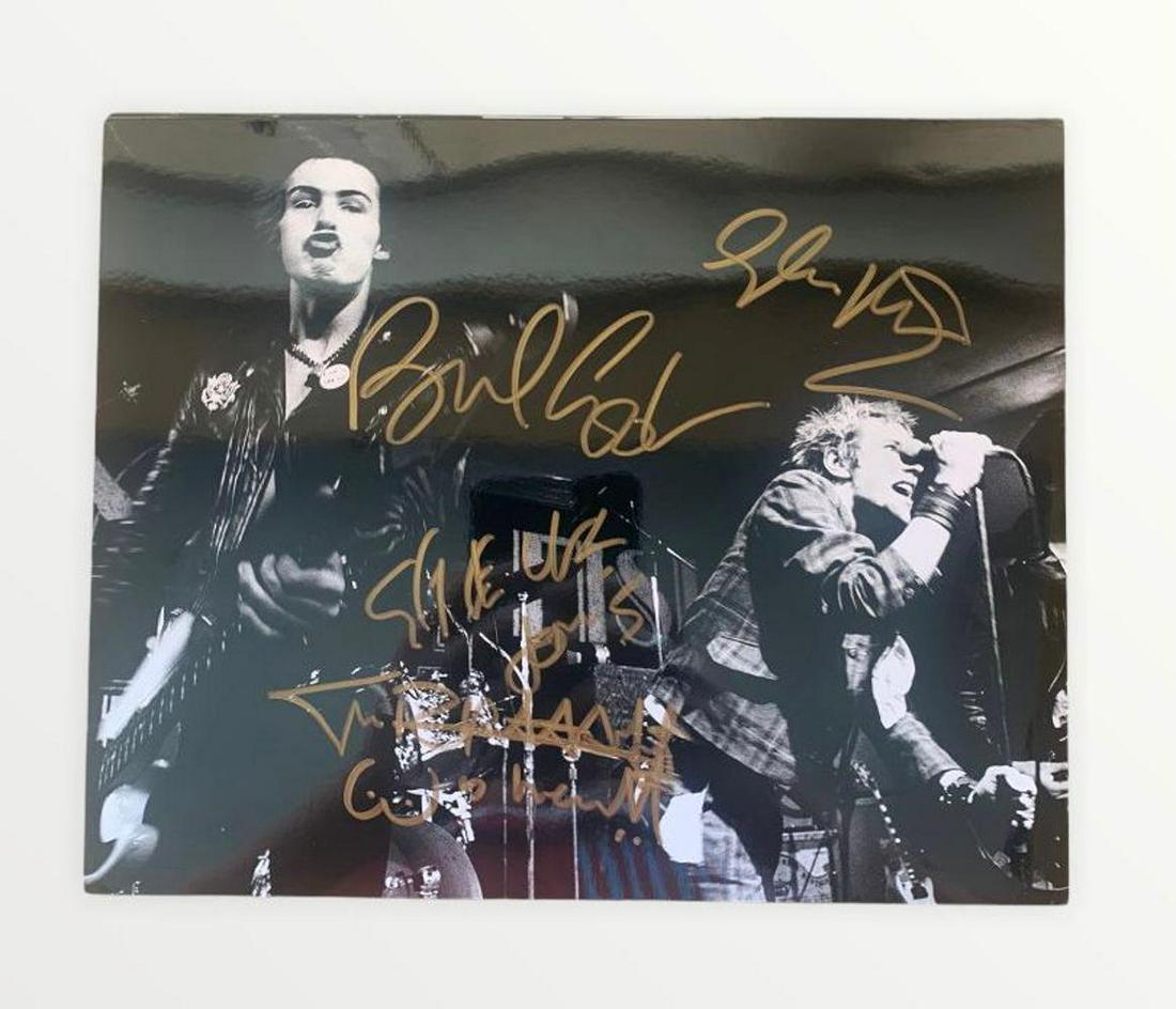 The Sex Pistols Fully Signed Photograph Certified.: This lot is a 10 x 8” photograph, autographed by Johnny Rotten, Paul Cook, Glen Matlock and Steve Jones of the Sex Pistols. Item comes with Certificate of Authenticity, guaranteeing it for a lif