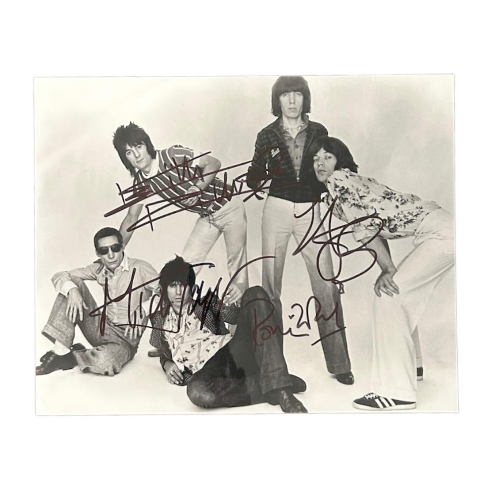 Rolling Stones Fully Signed photograph Certified: This lot is a photograph autographed by Ronnie Wood, Keith Richars, Charlie Watts and Mick Jagger of The Rolling Stones.