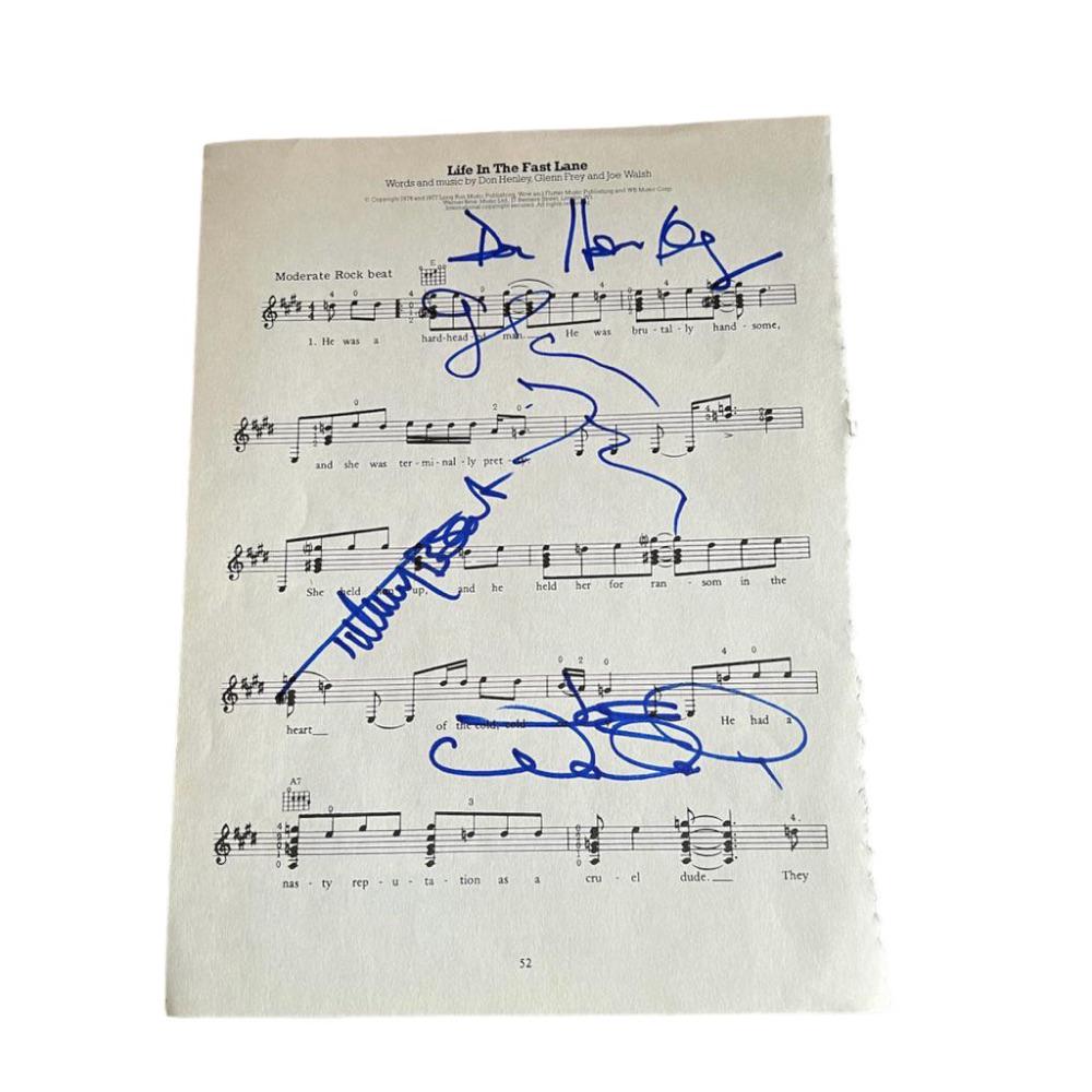 The Eagles Signed Life In The Fast Lane Sheet Music: This lot is a piece of sheet music (Life In The Fast Lane) autographed by Don Henley, Joe Walsh, Timothy B. Schmit and Glenn Frey of the Eagles. The Eagles are an American rock band formed in Los Ange