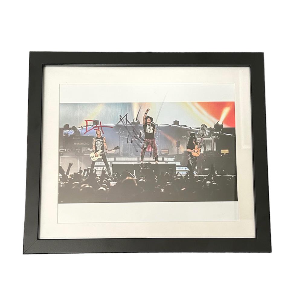 Axl Rose Guns N Roses Signed Photograph: This lot is a framed 10x8" print autographed by Axl Rose of Guns N Roses. The photo is housed within a mounted black wooden frame, an ideal display item for collectors. Item comes with Certificate of