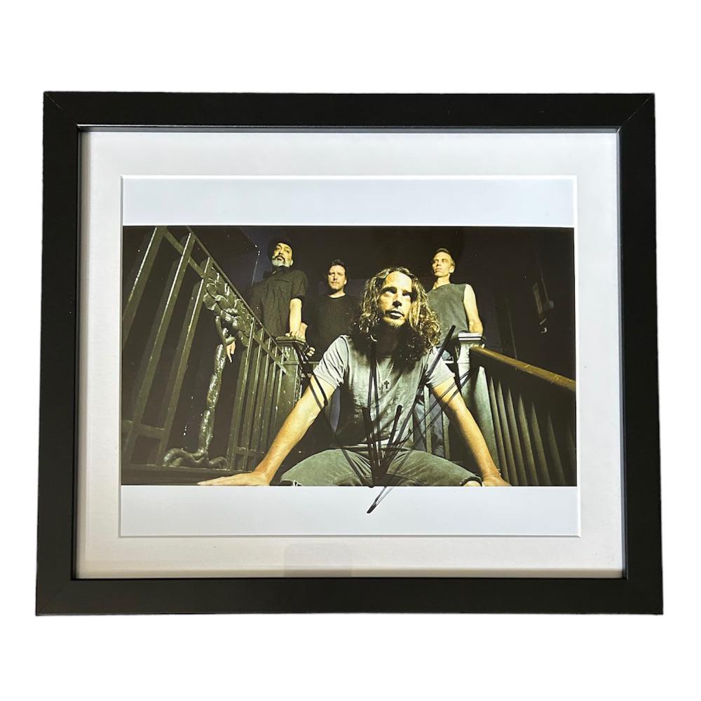 Chris Cornell Signed Photograph: This lot is a framed 10x8" print autographed by Chris Cornell. The photo is housed within a mounted black wooden frame, an ideal display item for collectors. Item comes with Certificate of Authenticit