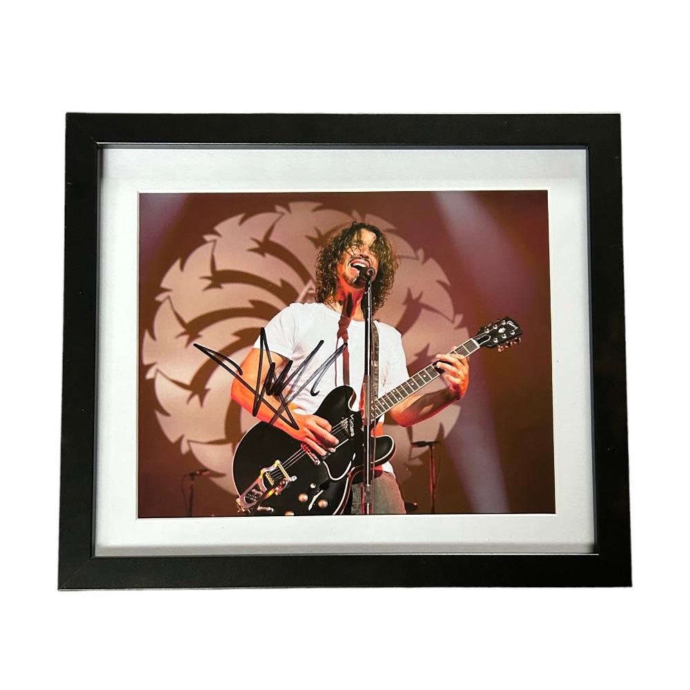 Chris Cornell Soundgarden Audioslave Signed Framed Photograph: This lot is a framed 10x8" print autographed by Chris Cornell of Soundgarden and Audioslave. The photo is housed within a mounted black wooden frame, an ideal display item for collectors. Soundgarden 
