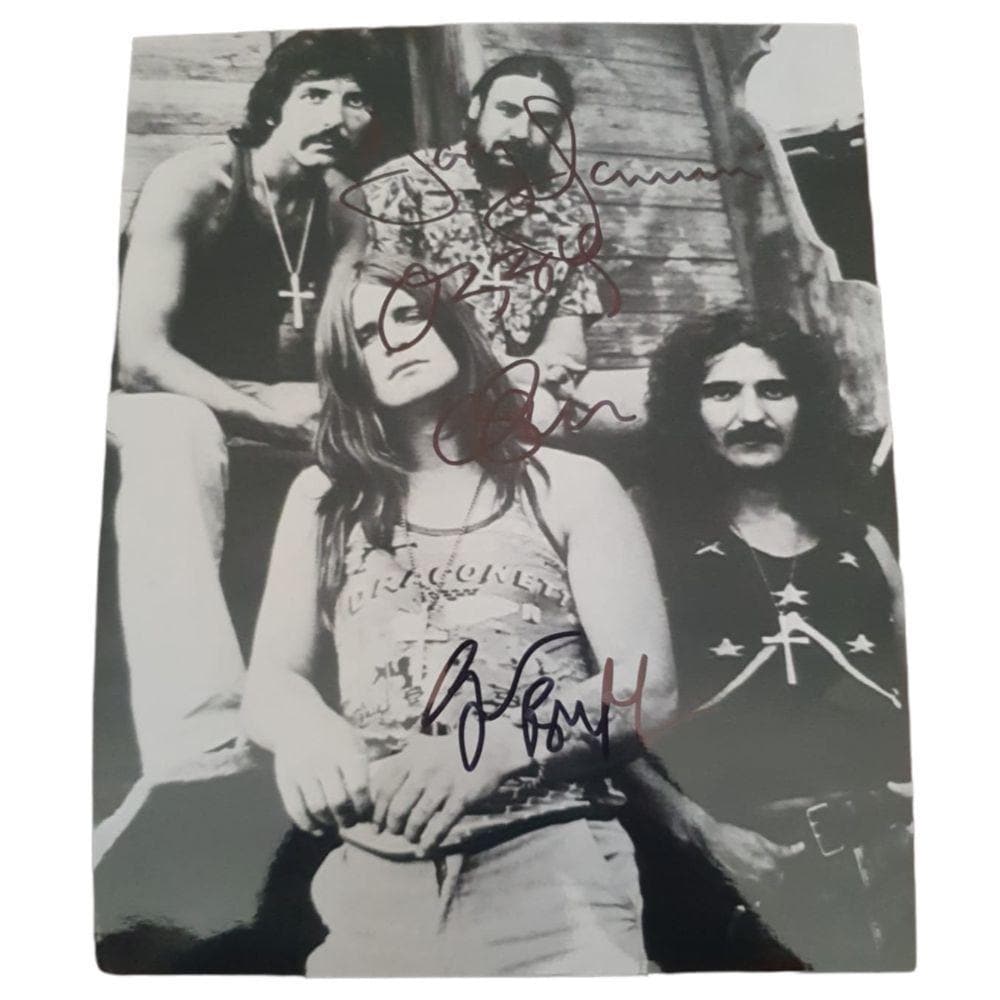 Black Sabbath Signed Photograph Certified: This lot is a photograph, autographed by Ozzy Osbourne, Tony Iommi, Geezer Butler and Bill Ward of Black Sabbath.