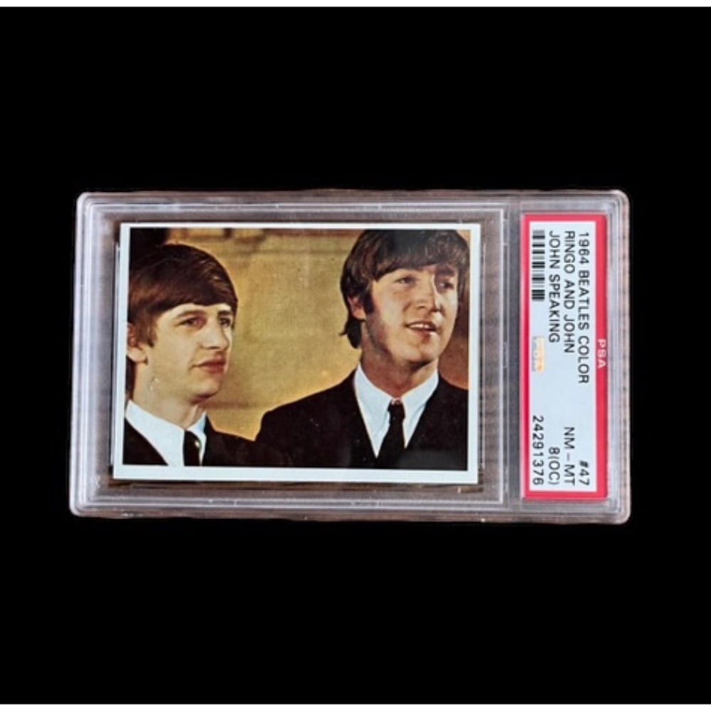 The Beatles 1964 Topps Beatles Color Cards Collector's Card PSA: This lot is a Topps 1964 Beatles Color Collector's Card featuring John Lennon and Ringo Starr of The Beatles. The Beatles are regarded as the most influential band of all time and are the best-selling