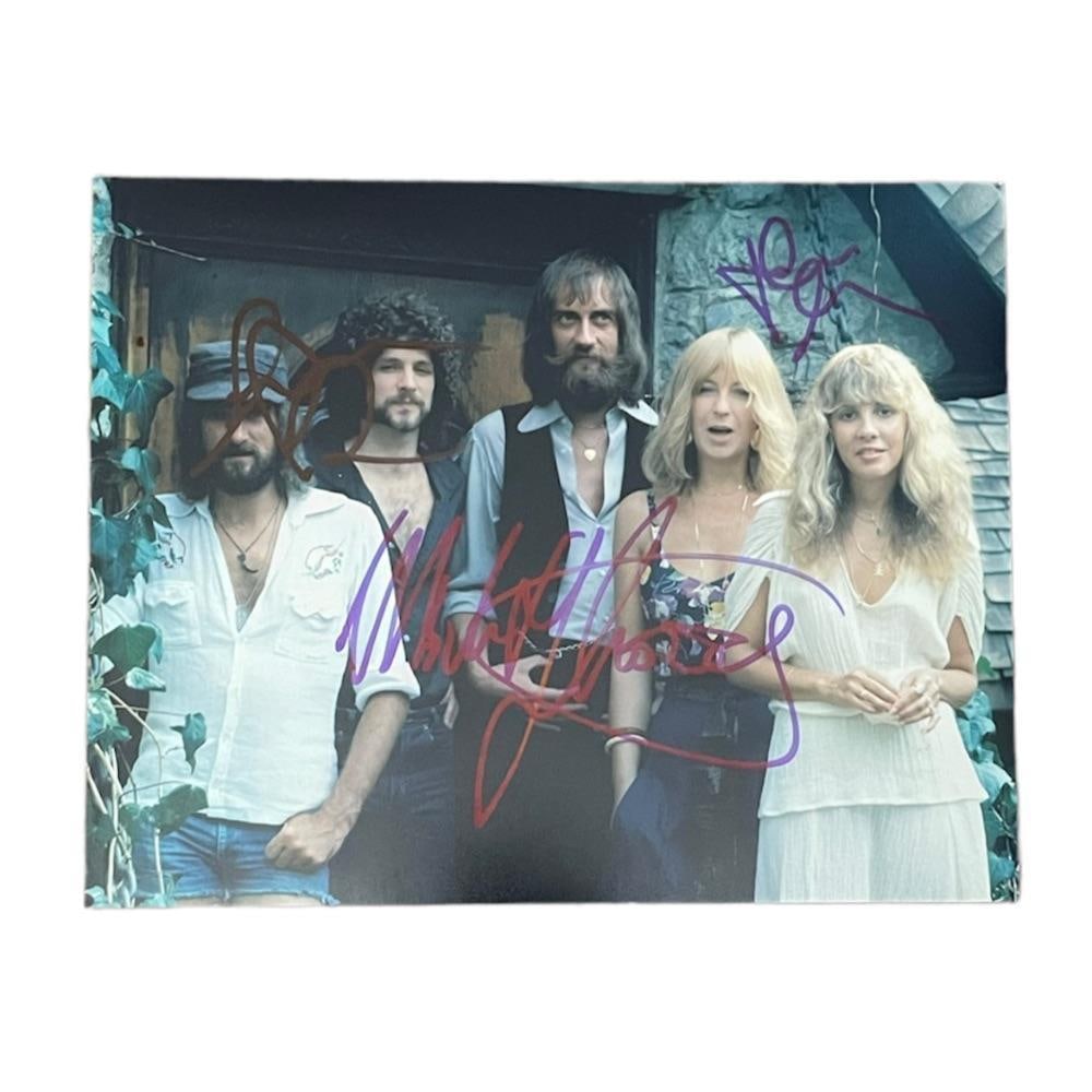 Fleetwood Mac Signed Photograph Certified.: This lot is a 10"x8" photograph autographed by Mick Fleetwood, John Mcvie and Lindsey Buckingham of Fleetwood Mac.
