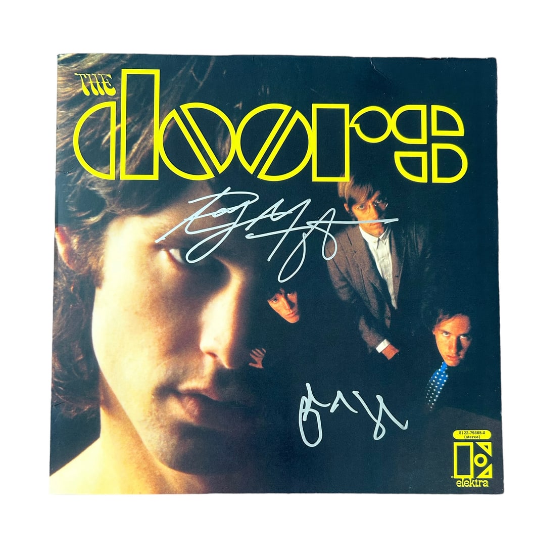 The Doors Signed 'The Doors' Vinyl LP: This lot is a vinyl LP 'The Doors' autographed by Ray Manzarek and John Densmore of The Doors. The Doors were an American rock band formed in Los Angeles in 1965, with vocalist Jim Morrison, keyboardi